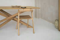 Solid wood table in modern dining room with natural light