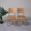 NordicStory Pack of solid oak dining chairs from the Mauritz collection Nordic furniture with a modern oak design.