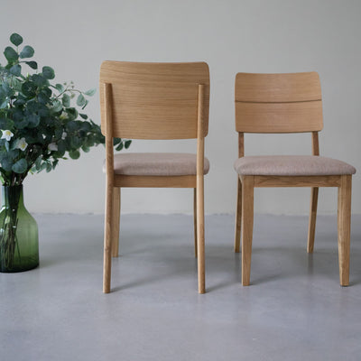 NordicStory Pack of upholstered solid oak dining chairs from the Mauritz collection Furniture in Nordic beige color with a modern design Oak.