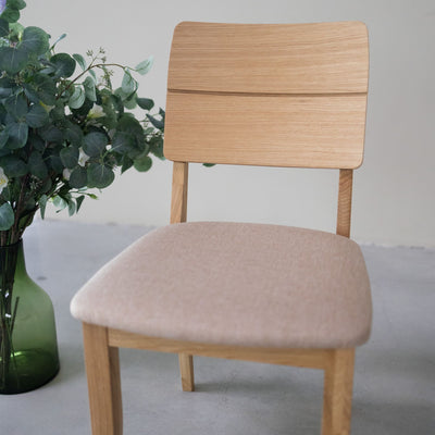 NordicStory Pack of upholstered solid oak dining chairs from the Mauritz collection Furniture in Nordic beige color with a modern design Oak.